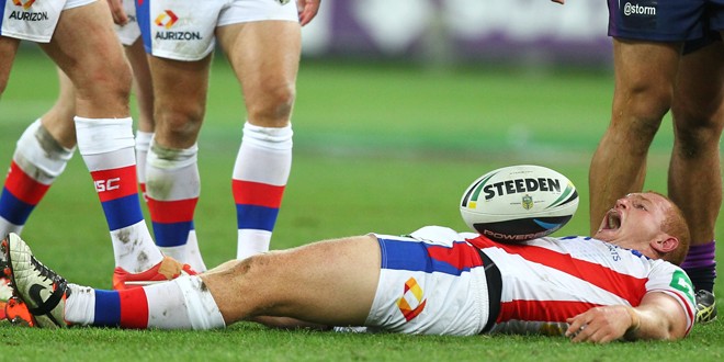 McKinnon in agony after landing on his head. ©Action