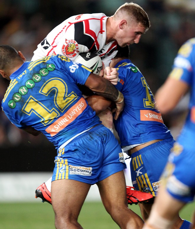 Welcome to the NRL, Sam: The Eels defence smash former Man of Steel Sam Tomkins, who plays for New Zealand Warriors. ©ActionPhotographics